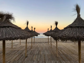 Scenic view of beach against sky during sunset