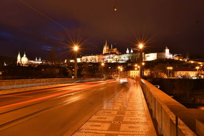 Light trails on road in city at night