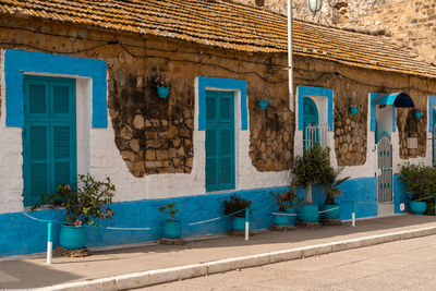 Stylish stone house washed in blue and white colours in asilah