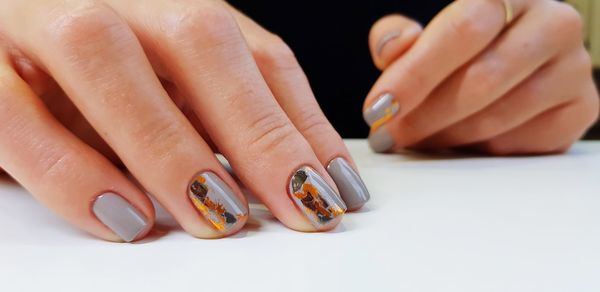 Cropped image of hand with nail polish