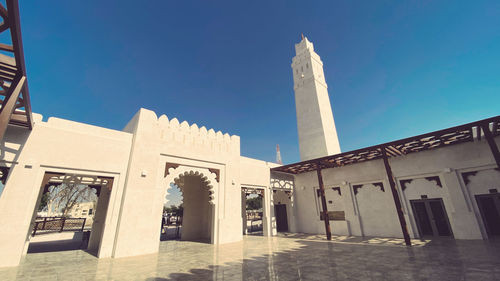 Low angle view of building against blue sky