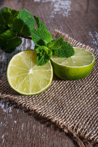 Lime with mint on rustic background