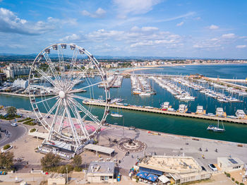 High angle view of ferris wheel in city