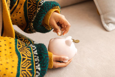 Cropped hand of woman holding gift