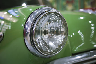 Circle headlight of retro vintage car . close up view 