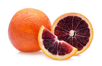 Close-up of oranges against white background