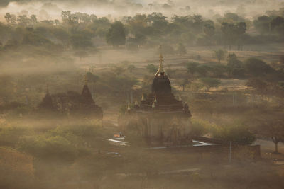 High angle view of temple during foggy weather