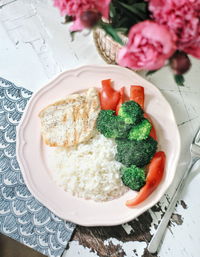 High angle view of rice and broccoli in plate on table