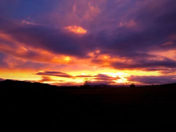 Scenic view of silhouette landscape against sky during sunset