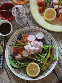 High angle view of fruits in plate on table