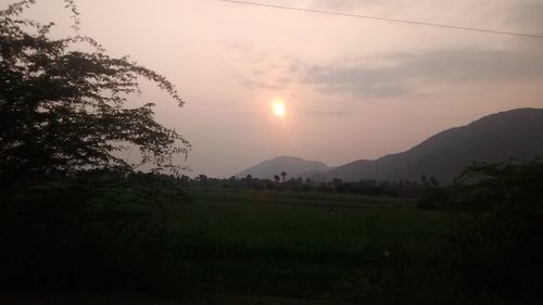 Scenic view of landscape against sky during sunset