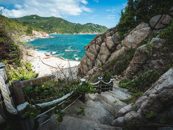 Scenic view of stair path down to hin ngam beach, koh tao island tropical paradise, thailand.