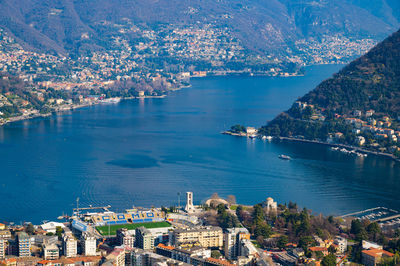 The city of como, the lake, the lakeside promenade, the buildings, photographed from above.