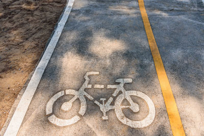 High angle view of bicycle sign on road