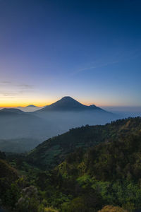 Scenic view of mountains against sky during sunset