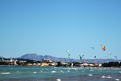 Scenic view of sea against clear blue sky
