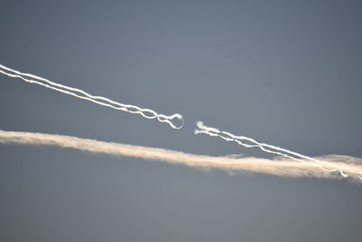 Low angle view of vapor trail against sky