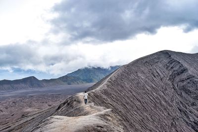 Scenic view of mountain against cloudy sky