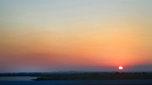 Scenic view of landscape at sunset