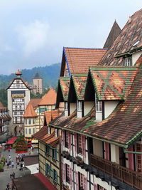 Houses in city against sky