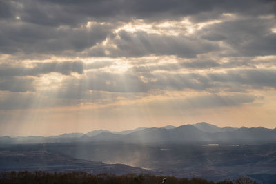 Scenic view of mountains against sky during sunset