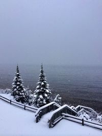 Scenic view of frozen landscape against sky