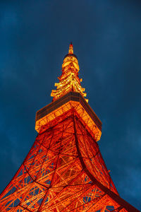 Low angle view of illuminated tower against sky