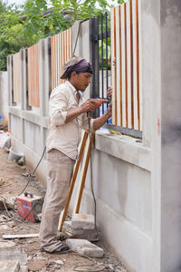 Side view of woman looking at camera