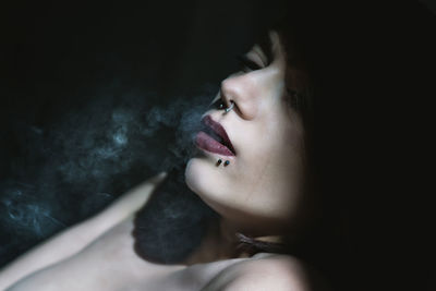Young woman with eyes closed