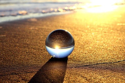 Close-up of crystal ball on table