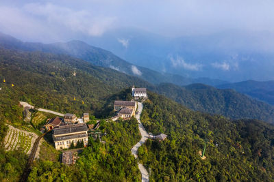 High angle view of trees and mountains against sky