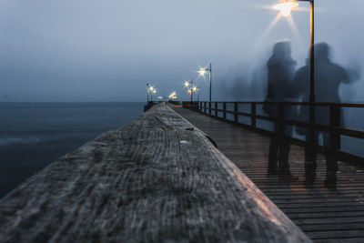 Pier over sea against sky