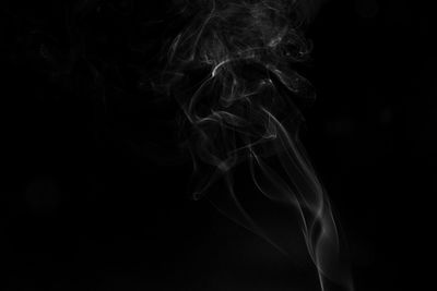 Close-up of smoke against black background