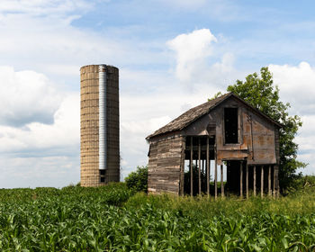 Built structure on field against sky