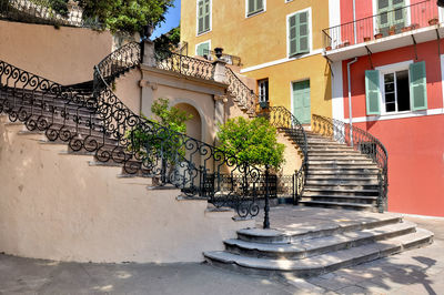 Staircase by building in city