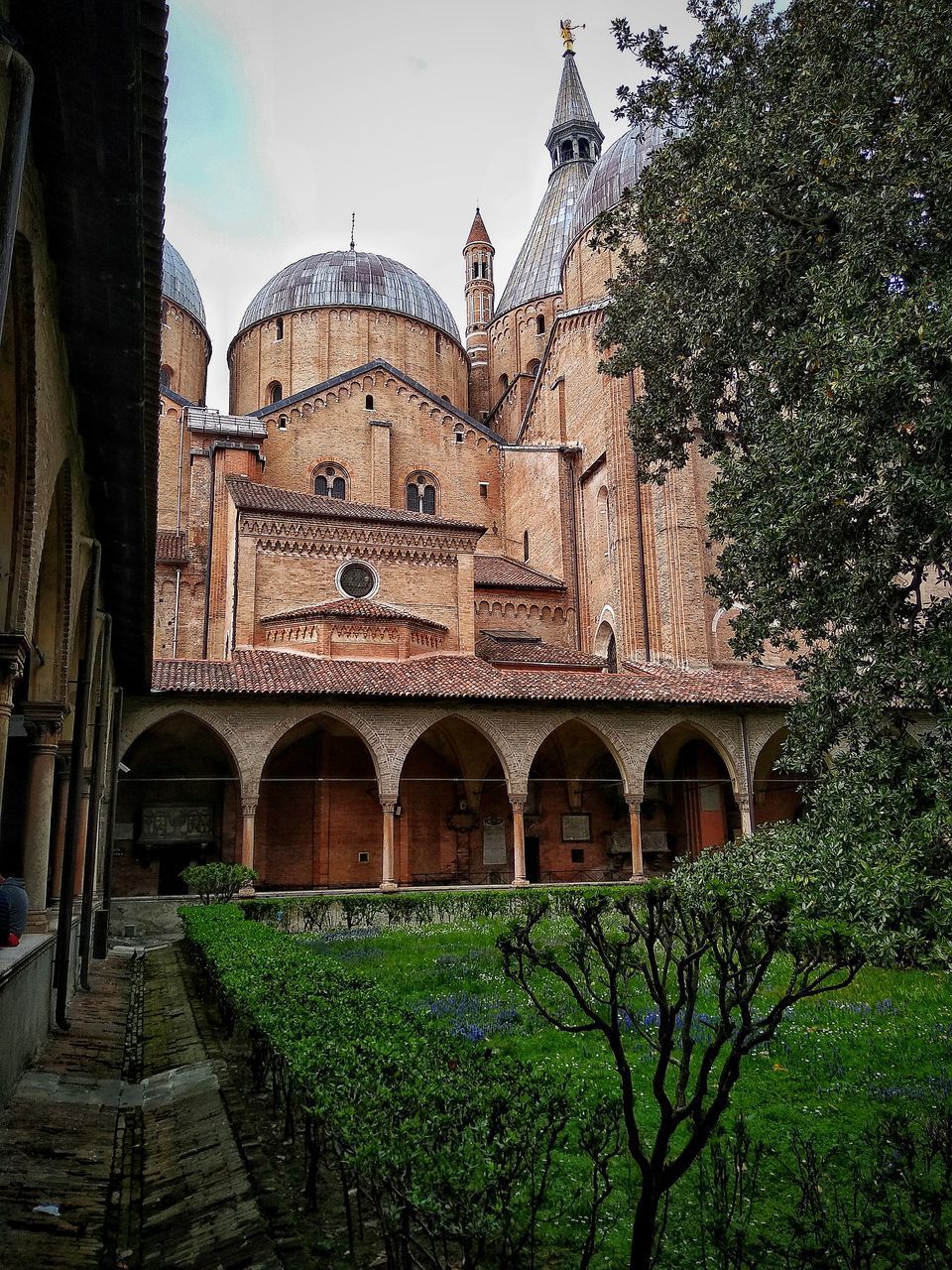 EXTERIOR OF HISTORIC BUILDING WITH TREES IN BACKGROUND