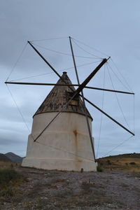 Traditional windmill against sky