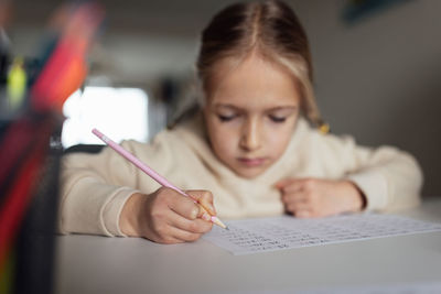 Portrait of young woman working at office