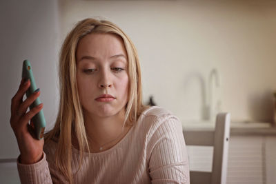 Young woman using mobile phone