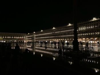 Reflection of illuminated buildings in water at night