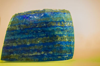 Close-up of blue stone against white background