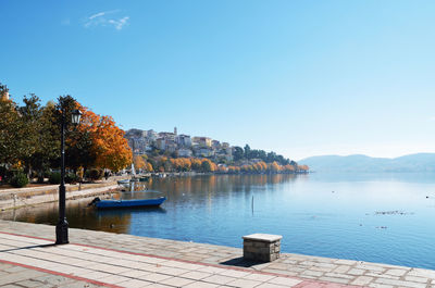 Scenic view of lake against clear sky during autumn