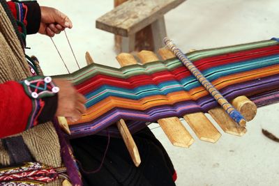 Close-up of a woman weaving