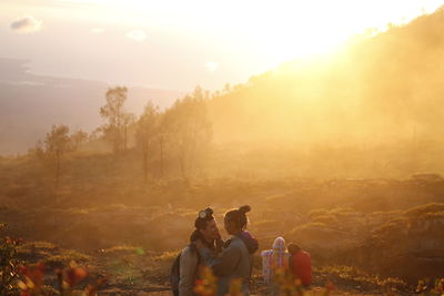 People enjoying at sunset