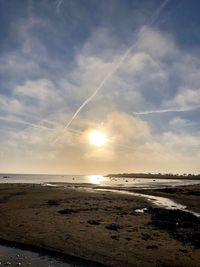 Scenic view of beach against sky during sunset