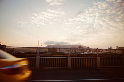 Close-up of road against sky at sunset