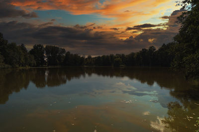 Scenic view of lake against sky during  sunrise