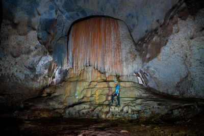 Man standing in cave