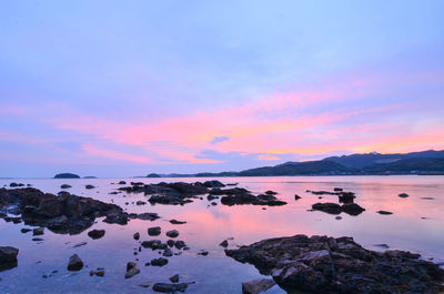 Scenic view of lake against sky during sunset