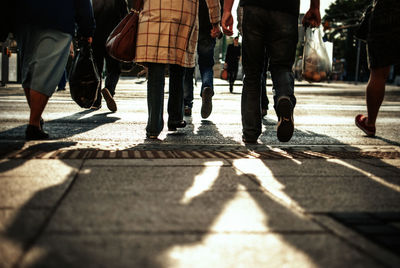 Low section of people crossing road